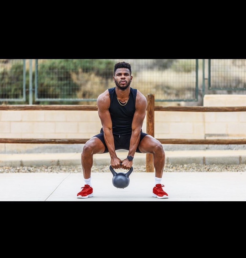 Athlete training with kettlebell